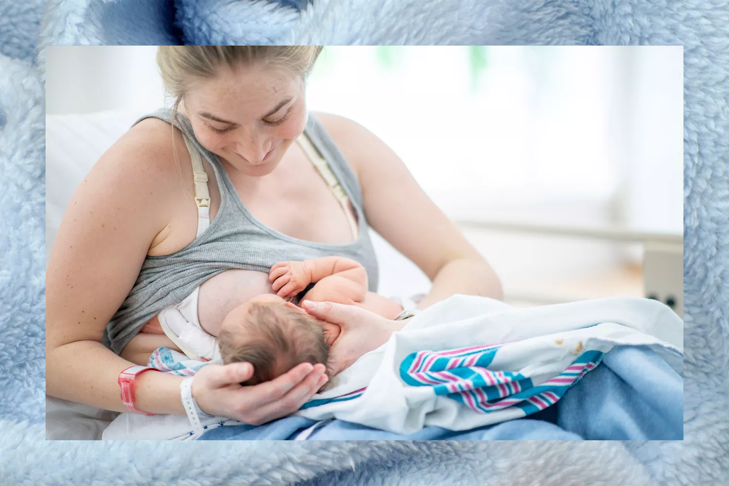 Mother breastfeeding newborn baby in hospital